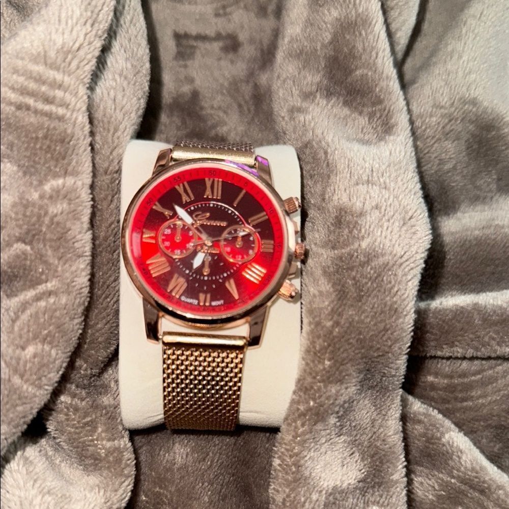 Geneva Gold and Red Watch with Chronograph Features